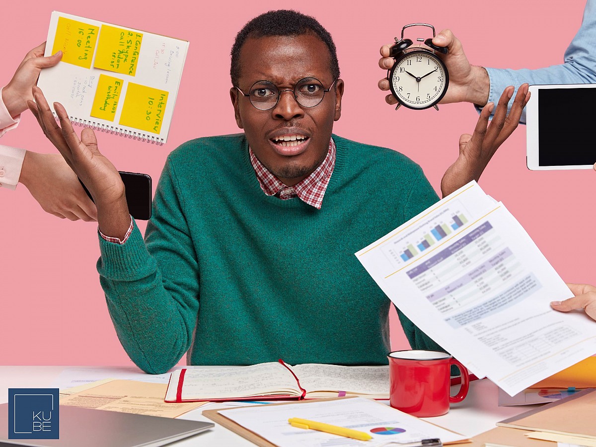 A man juggling with work timelines